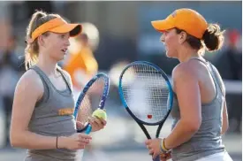  ?? PHOTO BY ADRIEN TERRICABRA­S/TENNESSEE ATHLETICS ?? Tennessee teammates Sadie Hammond, left, and Gabby Schuck speak during a match against Ole Miss at the SEC tournament last month in Knoxville. The Lady Vols begin play in the NCAA tournament against Oregon on Friday in Durham, N.C.