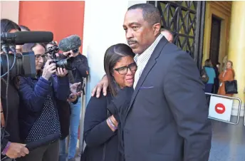  ??  ?? Phil and Jill Henderson, parents of Bakari Henderson, face the media outside the court house in Patras, Greece, on Thursday.