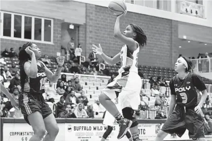  ?? KIM HAIRSTON/BALTIMORE SUN ?? Western junior guard Cache Waters, drives to the basket during the second half for two of her 20 points. “My coach said, ‘Take it to the hoop,’ so I took it to the basket and my teammates, we finished strong,” Waters said.