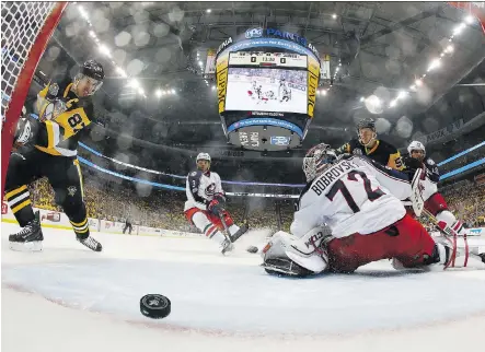  ?? GREGORY SHAMUS/ GETTY IMAGES ?? Sidney Crosby scored the first Pittsburgh Penguins goal Friday night on a nice feed from rookie Jake Guentzel that Columbus Blue Jackets goalie Sergei Bobrovsky had no chance of stopping. Pittsburgh won the game 4-1 and enjoy a 2-0 lead in the...