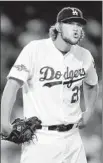  ?? Wally Skalij Los Angeles Times ?? CLAYTON KERSHAW helps get the Dodgers past the Atlanta Braves in division series and into the National League Championsh­ip Series.