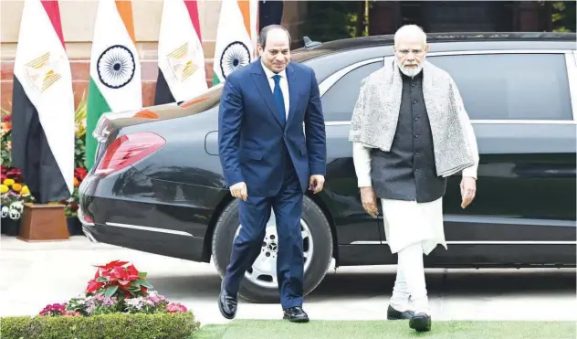  ?? Agence France-presse ?? ↑
Abdel Fattah Al Sisi (left) and Narendra Modi walk before their meeting at the Hyderabad House in New Delhi on Wednesday.