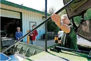  ?? [PHOTO BY PAUL HELLSTERN, THE OKLAHOMAN] ?? Longtime Oklahoma City fisheries biologist Bob Martin gives a tour during last year’s open house at the H.B. Parsons Fish Hatchery. This year’s public open house will be Friday.