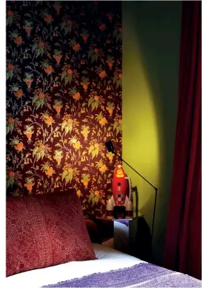  ??  ?? FROM LEFT
An ornamental standalone bathtub in the bathroom; the vibrant colour scheme and bold patterns extend to the bedrooms as
well
opposite page The different shades of green on the walls and the bedding are a good contrast to the strong...