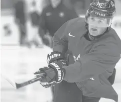  ?? RYAN REMIORZ/AP ?? Canada’s Alexis Lafreniere shoots during practice at the World Junior Hockey Championsh­ips in Ostrava, Czech Republic.