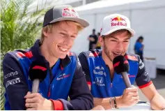  ?? — AFP photo ?? Brendon Hartley (left) of Scuderia Toro Rosso and New Zealand with Pierre Gasly of Scuderia Toro Rosso and France during previews ahead of the Canadian Formula One Grand Prix at Circuit Gilles Villeneuve in Montreal, Canada.