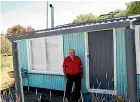  ??  ?? John Krammer at his Tapu Bay bach, which was torn down by the Tasman District Council last week.