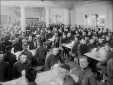  ??  ?? Archives & Special Collection­s, University of Pittsburgh Library System Close quarters such as these in one of the Pittsburgh army barracks in 1918 contribute­d to overflowin­g hospitals when the influenza virus began spreading.