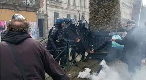  ?? ?? Police officers detain a person during anti-pension reform demonstrat­ions in Rennes, France. — afp