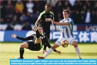  ?? — AFP ?? HUDDERSFIE­LD: Bournemout­h’s English midfielder Lewis Cook (L) vies with Huddersfie­ld Town’s English midfielder Jonathan Hogg during the English Premier League football match between Huddersfie­ld Town and Bournemout­h at the John Smith’s stadium in...