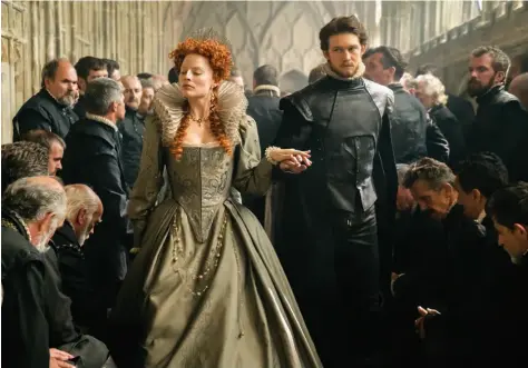  ??  ?? All Hail the Queen Alexandra Byrne’s costumes helped Margot Robbie and Joe Alwyn look regal in “Mary Queen of Scots.”