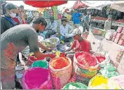  ?? ?? People buying Holi colours at Sadar Bazaar, in New Delhi.