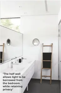  ??  ?? ‘THE HALF WALL ALLOWS LIGHT TO BE BORROWED FROM THE BEDROOM, WHILE RETAINING PRIVACY’