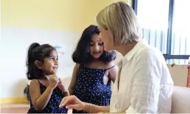  ?? Photograph: Supplied from the office of Kristina Keneally ?? ‘Like many little girls, they want to check out my rings, bracelet and necklace and show me their sparkly earrings.’ Senator Kristina Keneally with Kopica and Tharunicaa during her meeting with the Biloela family on Christmas Island.