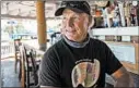  ??  ?? Tom Frank owns Captain Jack’s Good Time Tavern on Lake Ontario in Sodus Point, New York. His establishm­ent has suffered flood damage twice since 2017.