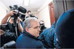  ?? AFP ?? Paul Whelan, centre, a former US Marine accused of espionage is escorted for a hearing at the Lefortovo Court in Moscow last year.