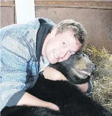  ??  ?? Mark Dallyn is the only person in the province who rehabilita­tes black bears, which he releases back into the wild.