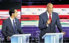  ?? Wilfredo Lee / Associated Press ?? Former Housing Secretary Julián Castro, left, and New Jersey Sen. Cory Booker argue that the thresholds make the debates less diverse. Neither qualified for Thursday’s debate.