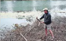  ?? KRIS DUBÉ THE WELLAND TRIBUNE ?? Doug Todd, a local resident upset with how a portion of the shore of the Welland River was left after work completed recently by Welland Hydro.