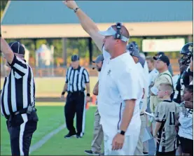  ?? kevin myrick ?? Head coach Biff Parson throws up signals for his team as they get ready for a play against Central Carroll. Rockmart won in a 51-14 finish.