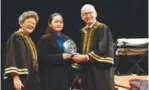  ??  ?? Celine (middle) receiving the Most Inspiring Student 2017 award from Walker (right), accompanie­d by MCKL CEO Moey Yoke Lai (left).