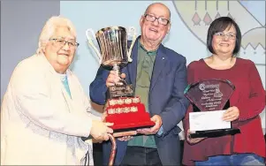  ??  ?? Beloved elder Katy McEwan, recipient of the Grand Chief Membertou Lifetime Achievemen­t Award, is seen here with Chief Terry Paul and daughter Natalie.