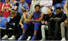  ?? CHRIS SZAGOLA — THE ASSOCIATED PRESS ?? Philadelph­ia 76ers’ Joel Embiid, of Cameroon, looks on with fans prior to the first half in Game 1 of a first-round NBA basketball playoff series against the Miami Heat, Saturday.