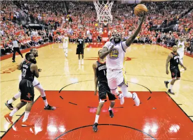  ?? Carlos Avila Gonzalez / The Chronicle ?? Draymond Green puts in a layup in the first half of the Warriors’ series-opening win Monday. He finished with just five points, but his nine assists, nine rebounds, two blocks and plus-19 rating led Golden State.