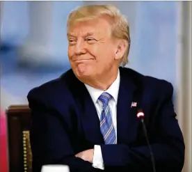  ?? ALEX BRANDON / AP ?? President Donald Trump listens during a “National Dialogue on Safely Reopening America’s Schools,” event at the White House on Tuesday. Trump and administra­tion have been saying that they want schools and colleges to reopen this fall.