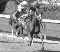  ?? Arkansas Democrat-Gazette/MITCHELL PE MASILUN ?? Ricardo Santana Jr. rides Whitmore to a 3¾-length victory over Apprehende­r in the Count Fleet Handicap on Saturday at Oaklawn Park in Hot Springs. Santana’s winning time was 1:08.35.