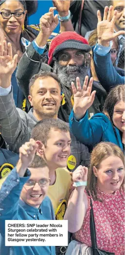  ?? ?? CHEERS: SNP leader NIcola Sturgeon celebrated with her fellow party members in Glasgow yesterday.