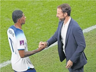  ?? | EPA ?? ENGLAND coach Gareth Southgate interacts with Manchester United player Marcus Rashford.