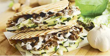  ??  ?? Tastes Greek to me: The Beef Gyro is loaded with broiled steak tips in tzatziki sauce.