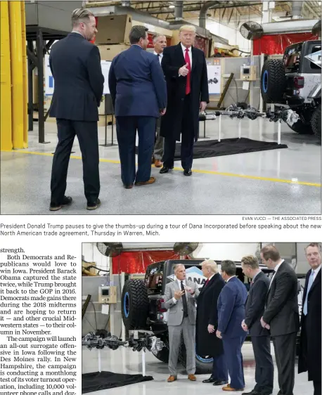  ?? EVAN VUCCI — THE ASSOCIATED PRESS ?? President Donald Trump pauses to give the thumbs-up during a tour of Dana Incorporat­ed before speaking about the new North American trade agreement, Thursday in Warren, Mich.