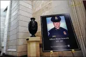  ?? SALWAN GEORGES/WASHINGTON POST ?? A sign outside the Capitol Rotunda memorializ­ed Officer Brian D. Sicknick, 42, who died the day after engaging rioters during the assault on the Capitol by a mob of violent Trump supporters.