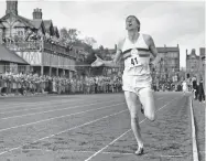  ?? ASSOCIATED PRESS FILE PHOTO ?? British athlete Roger Bannister breaks the tape May 6, 1954, to become the first man ever to break the four-minute barrier in the mile at Iffly Field in Oxford, England. Bannister died peacefully Sunday in Oxford at age 88. Bannister’s family said in a...