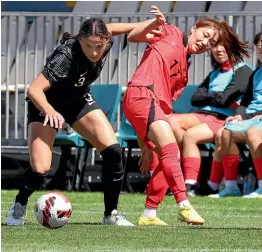  ?? ?? Football Ferns defender Claudia Bunge contests possession with a South Korean rival.