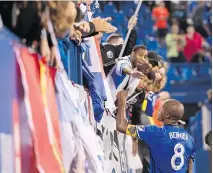  ?? THE CANADIAN PRESS ?? Impact captain Patrice Bernier greets fans following the team’s 1-0 loss to New York City FC on Wednesday night in Montreal. Bernier called the team “lifeless” following the loss on home field.