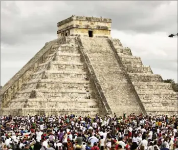  ?? ALEJANDRO MEDINA/AFP ?? Thousands of tourists surround the Kukulcan Pyramid at the Chichen Itza archaeolog­ical site during the celebratio­n of the spring equinox in the Yucatan state, Mexico, in March 2016.