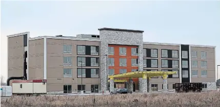  ?? DAVE JOHNSON TORSTAR ?? Work on the 80-room Holiday Inn Express and Suites in Welland was halted due to the most recent provincial lockdown. General manager Karen Hardcastle said the hotel, which is mostly complete on the outside, is expected to open in June instead of March.