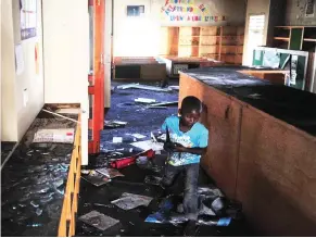  ?? Picture: Phando Jikelo/African News Agency(ANA) ?? DESTROYED: The Zwelihle community library was set alight during a violent protest by residents of Zwelihle informal settlement in Hermanus.