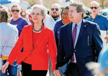  ?? [PHOTO BY NATE BILLINGS, THE OKLAHOMAN] ?? Drew Edmondson and his wife, Linda Edmondson, walk along the south side of the state Capitol on the way for him to file to run for governor as a Democrat during candidate filing in Oklahoma City.