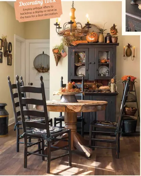  ??  ?? Left: Julie brought cozy continuity to the intimate breakfast area by taking cues from the pewter and tin pieces showcased in the cabinet when selecting other decor, including the chandelier, centerpiec­e and vintage milk can. Orange elements shine bright amid the otherwise dark furniture.