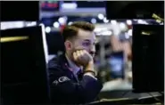  ?? ASSOCIATED PRESS ?? Specialist Matthew Greiner works at his post on the floor of the New York Stock Exchange.