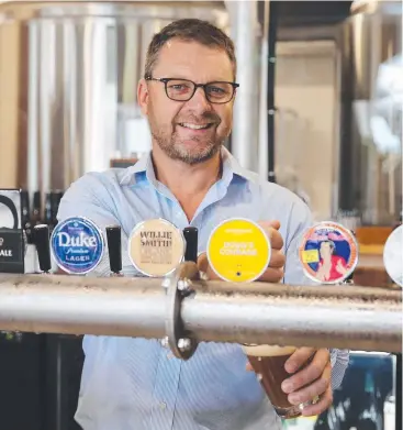  ?? Picture: BRENDAN RADKE ?? COOL POUR: Hemingway’s Brewery CEO and co-founder Tony Fyfe says it will be business as usual while the new Reef Marina owners at Port Douglas plan for the future.