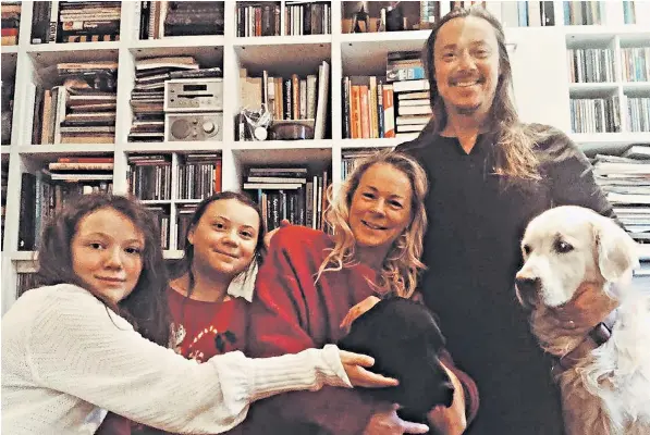  ??  ?? Climate activist Greta Thunberg, second left, with her sister Beata and parents Malena Ernman and Svante Thunberg, who radically changed their lifestyle to help her depression