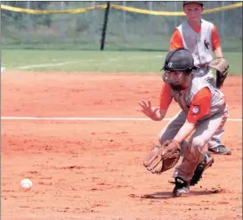  ??  ?? Hagen English of the LaFayette 8-year-old Rangers gets in position to scoop up a ball during a Dizzy Dean state tournament game in Calhoun last week. (Messenger photo/Scott Herpst)