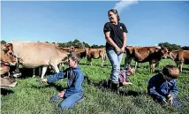  ??  ?? Mary Williams and her children George, 8, Ruby, 5, and Charlie, 6, check on the herd.