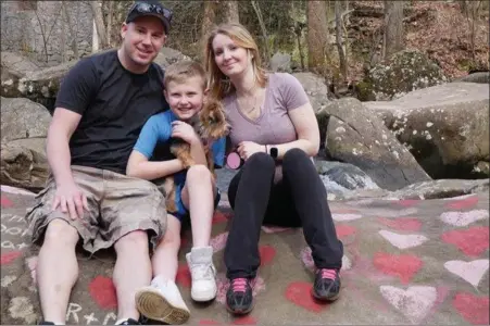  ?? Photo froM gofUnDMe Page ?? from left, Josh Knarr, Preston Dray and Pam Snyder. Pam and her son Preston died in floodwater­s on July 11. this family photo was posted on a gofundMe page set up by friends of the family.