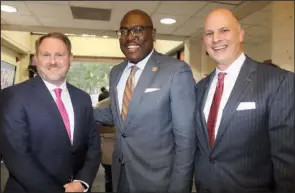  ?? ?? Chad Aduddell with Little Rock Mayor Frank Scott Jr. and Christian O’Neal